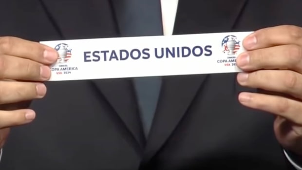 A close-up of a piece of paper featuring the name 'Estados Unidos' during the draw ceremony for the 2024 Copa America tournament